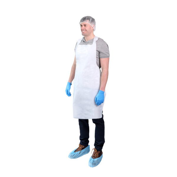 Man wearing a white 28"x46" heavyweight poly apron, blue gloves, shoe covers, and a hair net, shown on a white background.