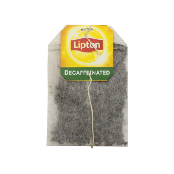 Lipton decaffeinated tea bag with a yellow and green tag labeled 'Decaffeinated', attached to a filled tea pouch with string.