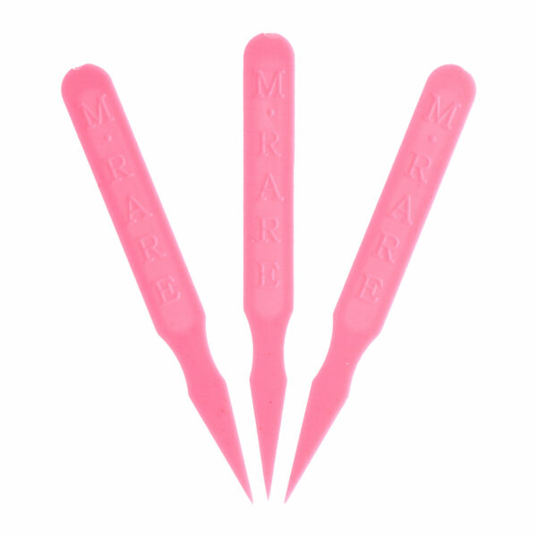 Three pink plastic steak markers embossed with “M. RARE,” displayed with pointed ends downward on a white background.