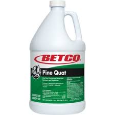 White gallon bottle of Betco Pine Quat Disinfectant with a green label. A powerful quaternary-based cleaner and disinfectant with a fresh pine scent, designed for commercial and industrial use.