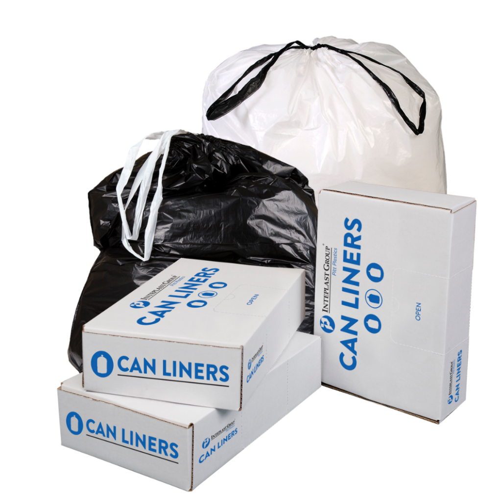 Two large drawstring trash bags, one black and one white, tied at the top, placed behind several stacked white boxes labeled "Can Liners." The image highlights the durability and packaging of the drawstring can liners, ideal for commercial and residential waste disposal.