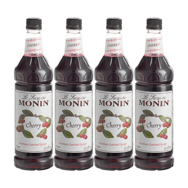 Four bottles of Monin Cherry Premium Gourmet Syrup arranged neatly, displaying the clear label and rich cherry-red syrup color.