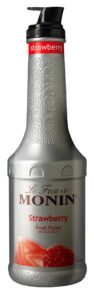 Silver plastic 1-liter bottle of Monin Strawberry Fruit Purée with a textured silver grip, red label at the top, pump dispenser, and image of strawberries on the front.