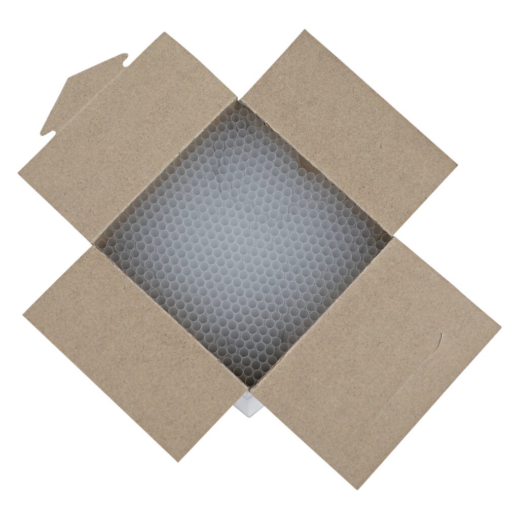 Open cardboard box showing neatly packed clear plastic jumbo straws arranged vertically.