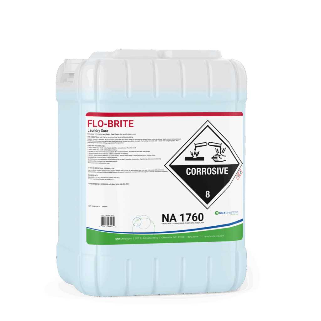 A 5-gallon light blue plastic container of Christeyns Flo-Brite Laundry Sour with a white label, red header, and a large corrosive hazard symbol on the front.