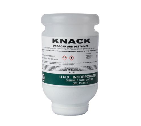 White plastic container of KNACK Pre-Soak and Destainer by U.N.X. Incorporated, labeled with safety warnings and product information, 7.5 lbs.